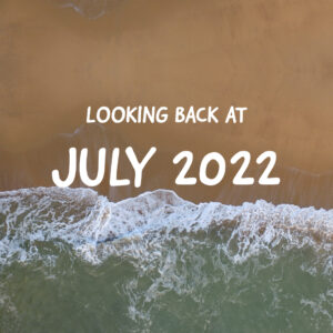 graphic of a beach with the words Looking Back at July 2022
