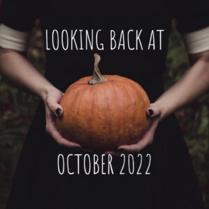 photo of a person holding a pumpkin with the words Looking Back at October 2022 